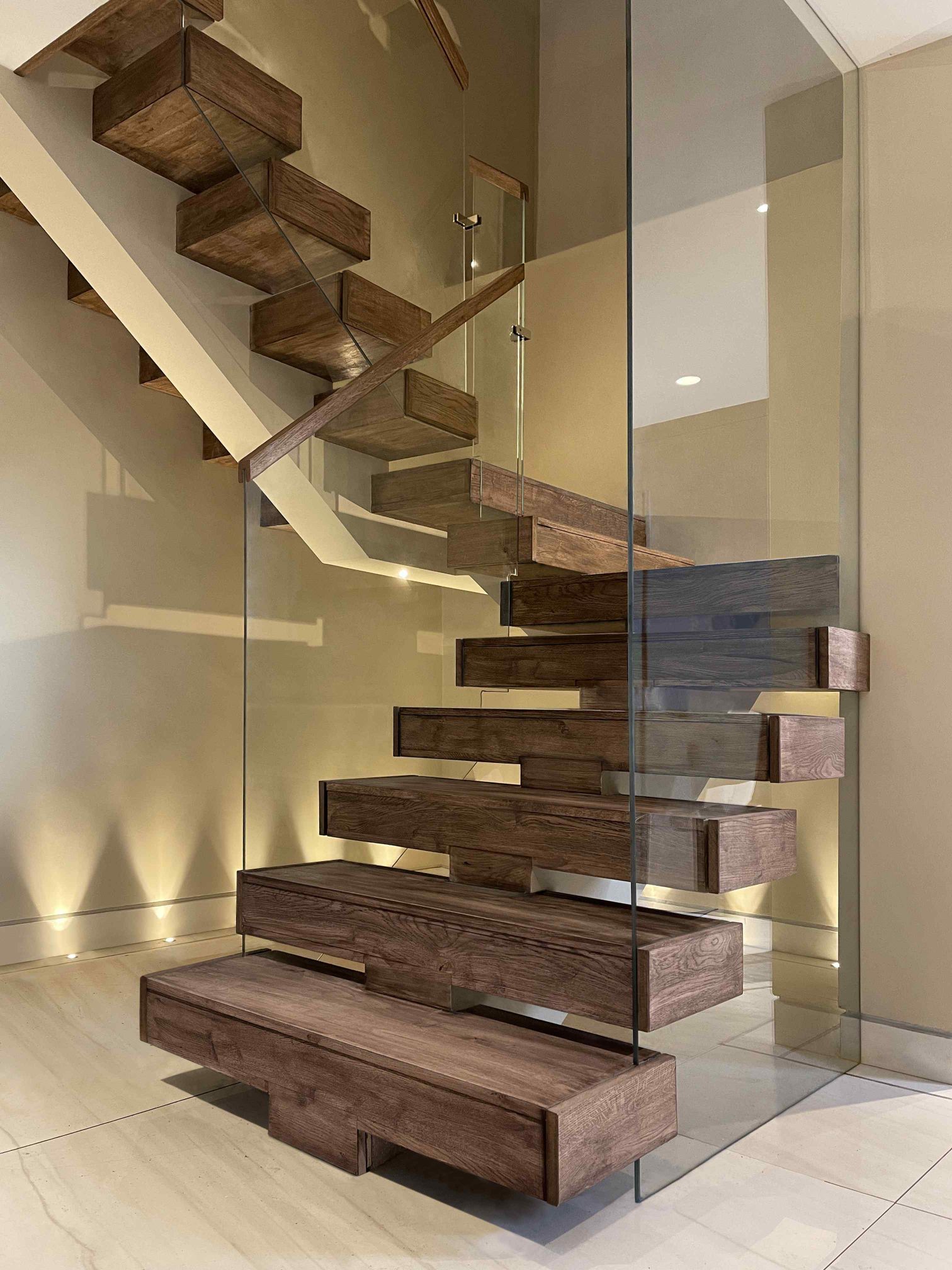 Bespoke spine staircase with Glass balustrade
