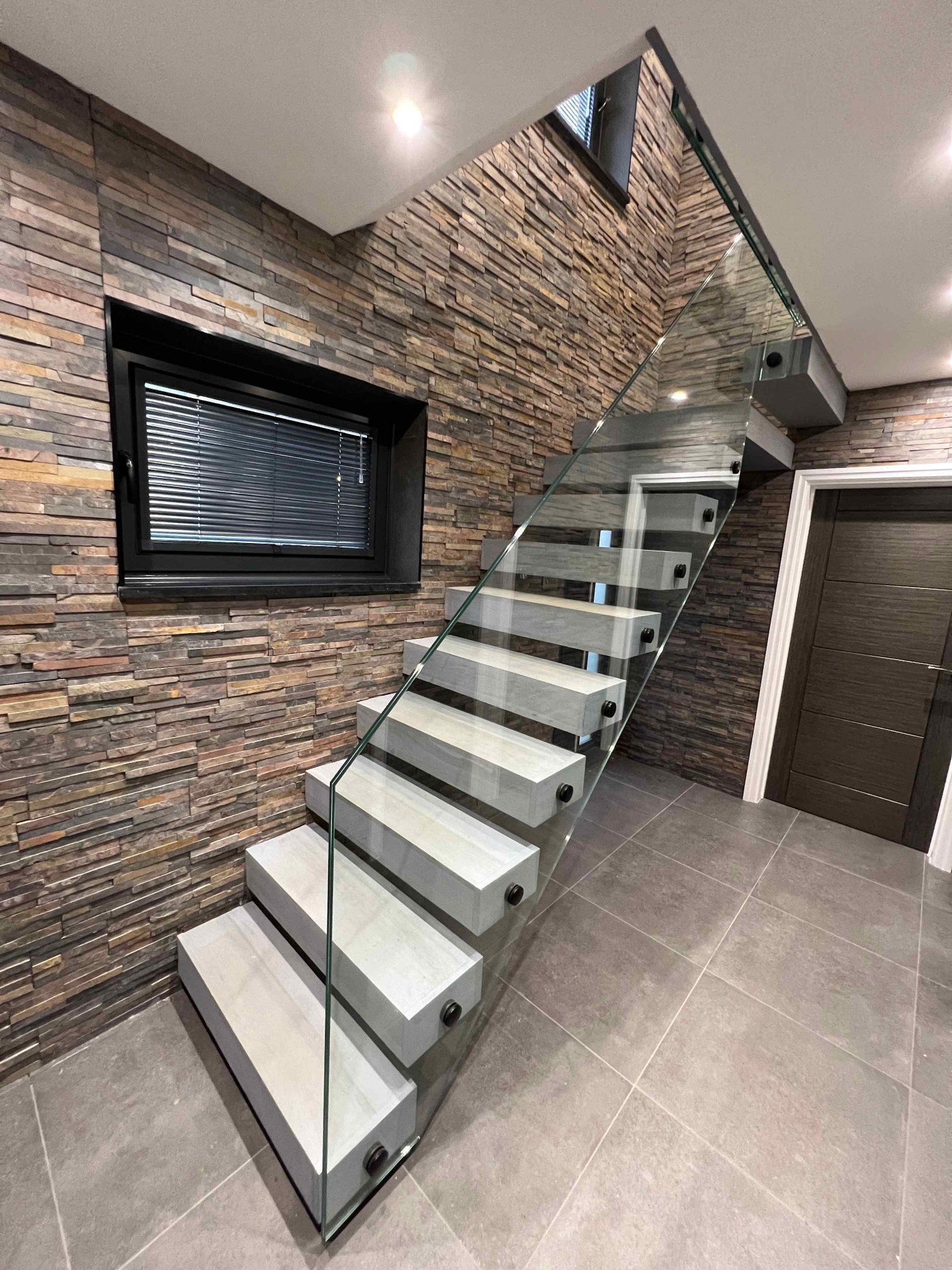 Bespoke floating staircase with glass balustrade