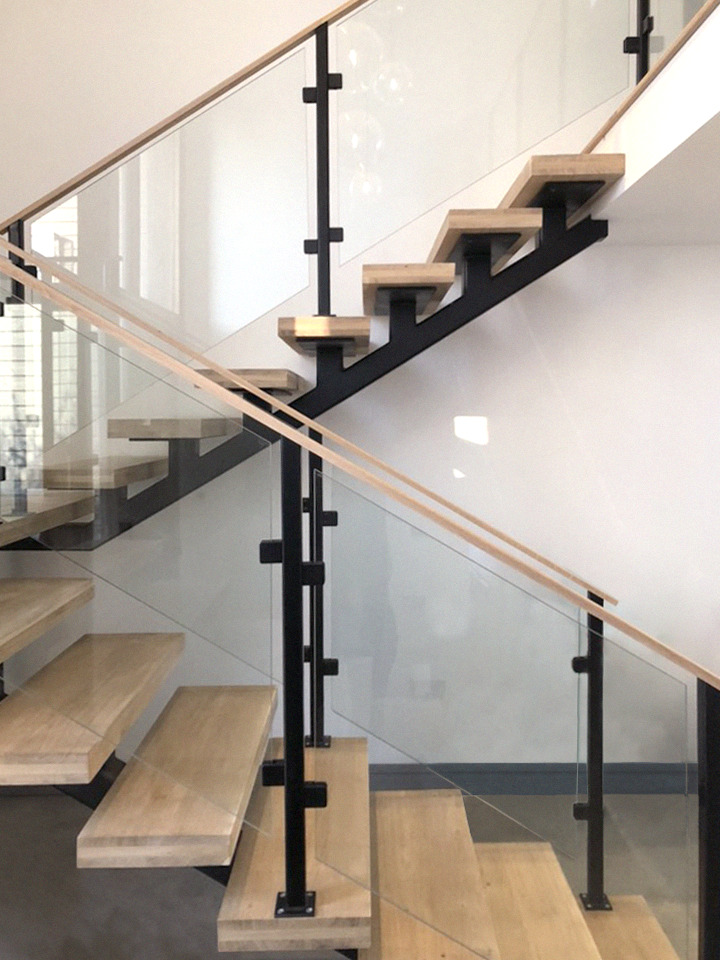 Bespoke spine staircase with Glass balustrade