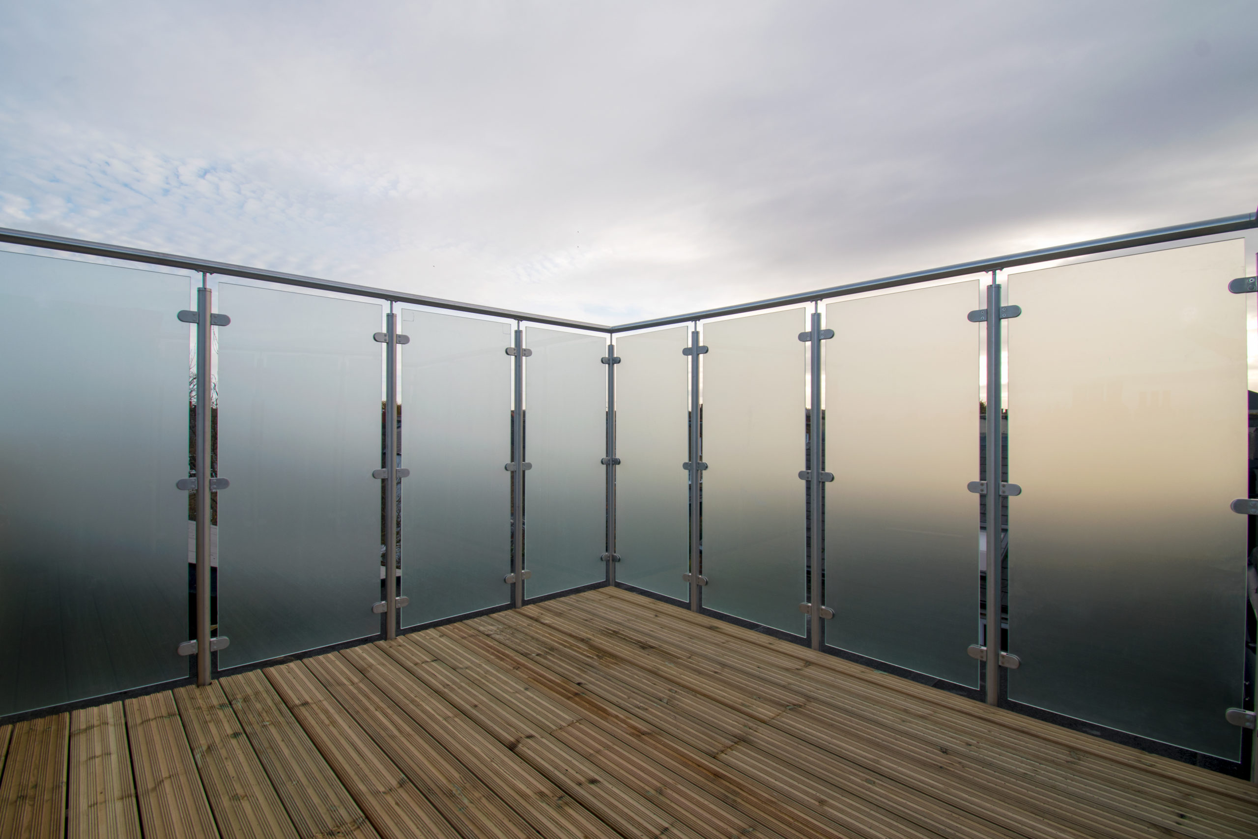 frosty glass balustrades with metal handrail