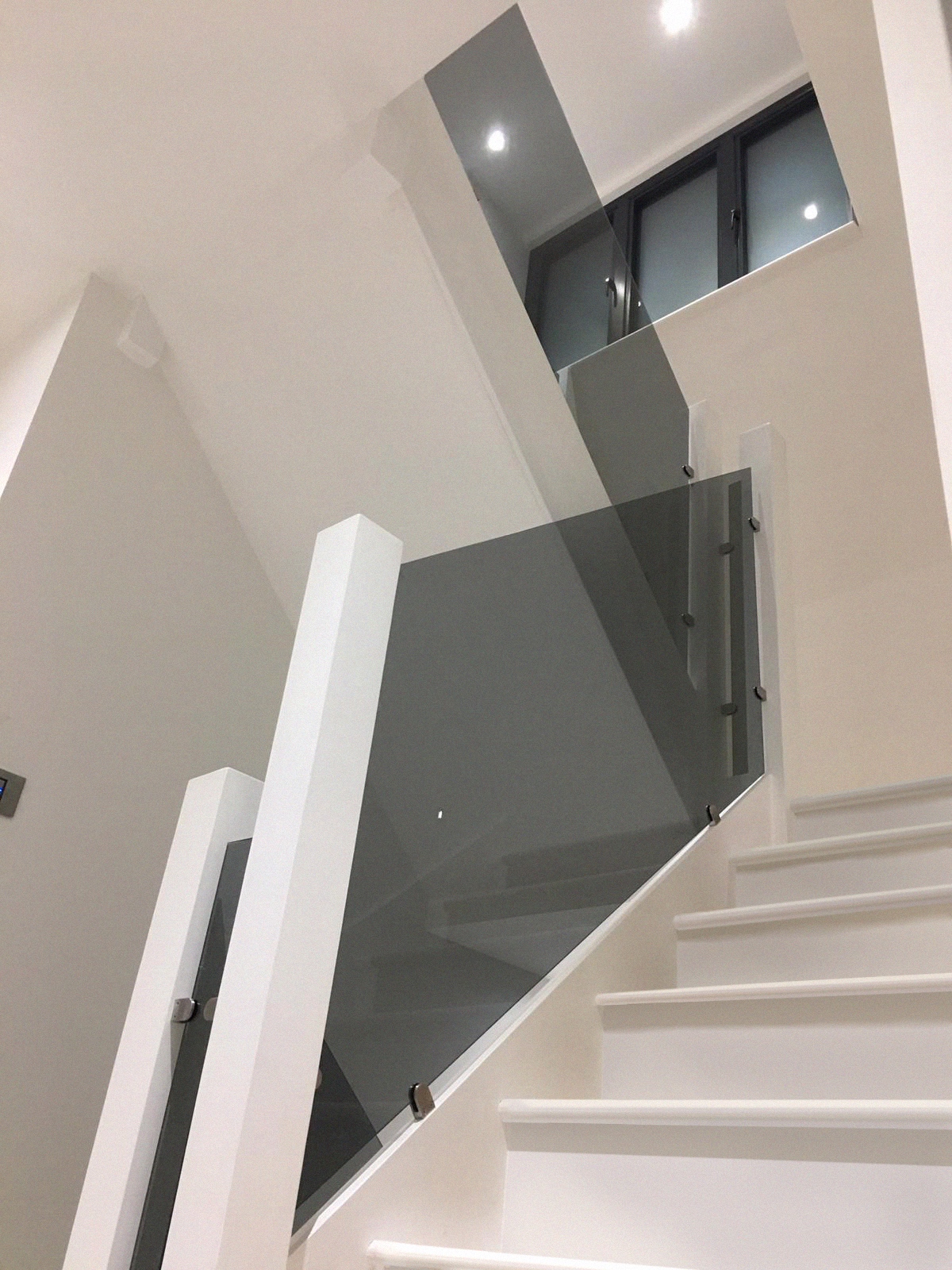Indoor Staircase with tinted glass balustrade