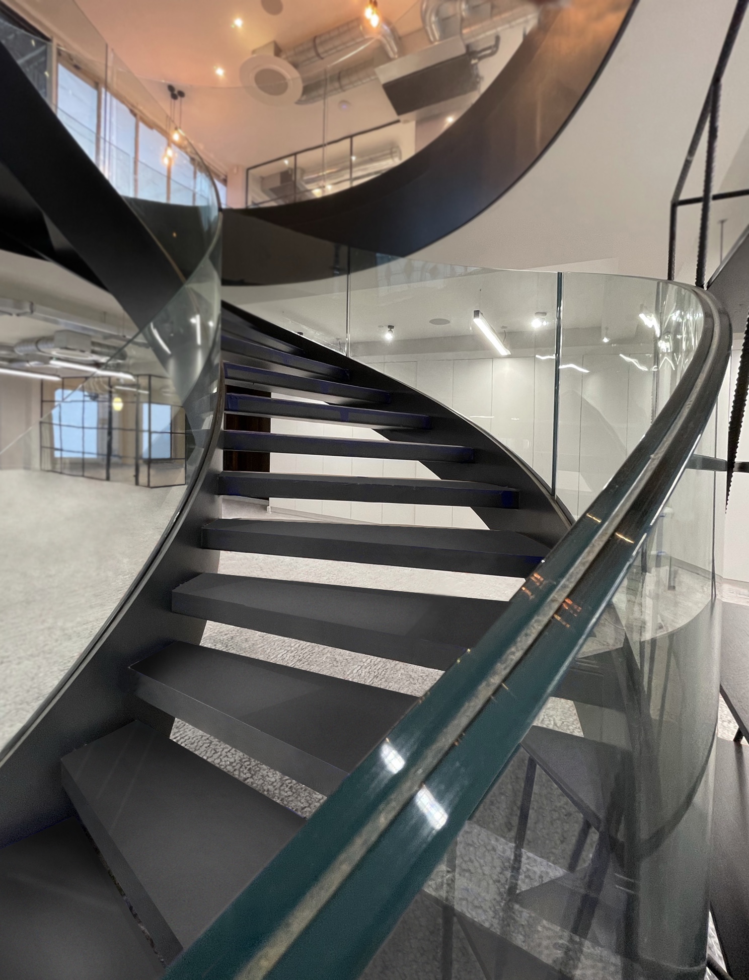 helical staircase with curved glass balustrade