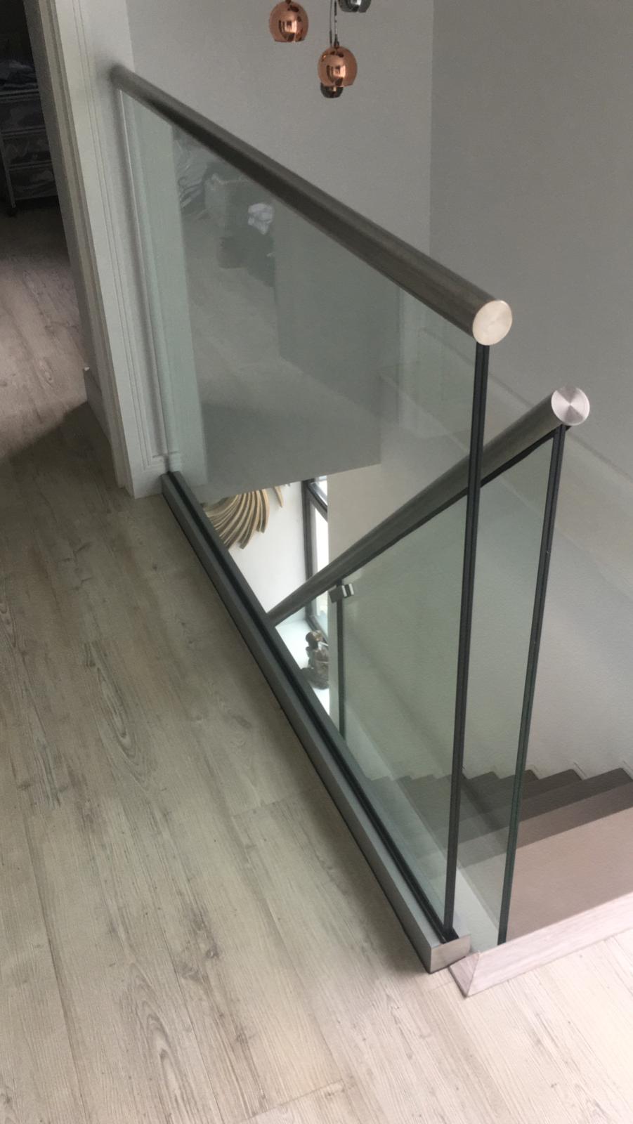 Glass balustrade with steel banister