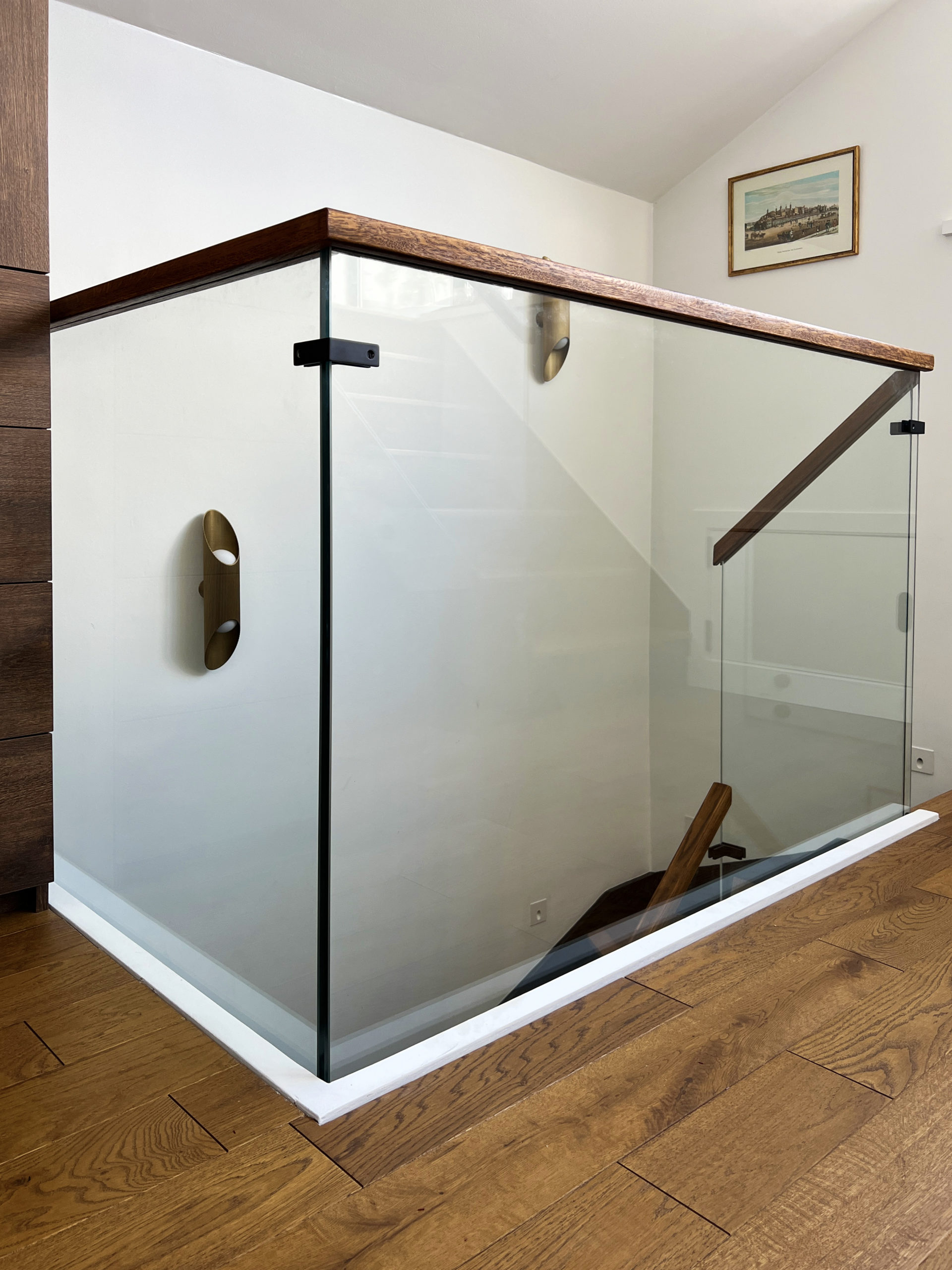 Glass balustrades with wooden handrail on top