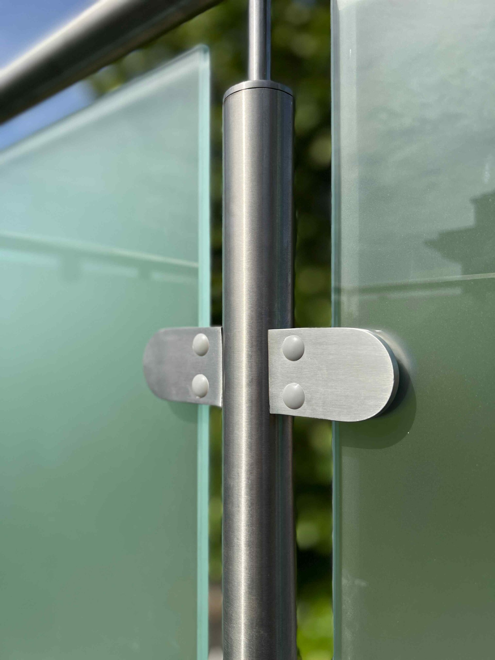 Steel clamps holding glass balustrade