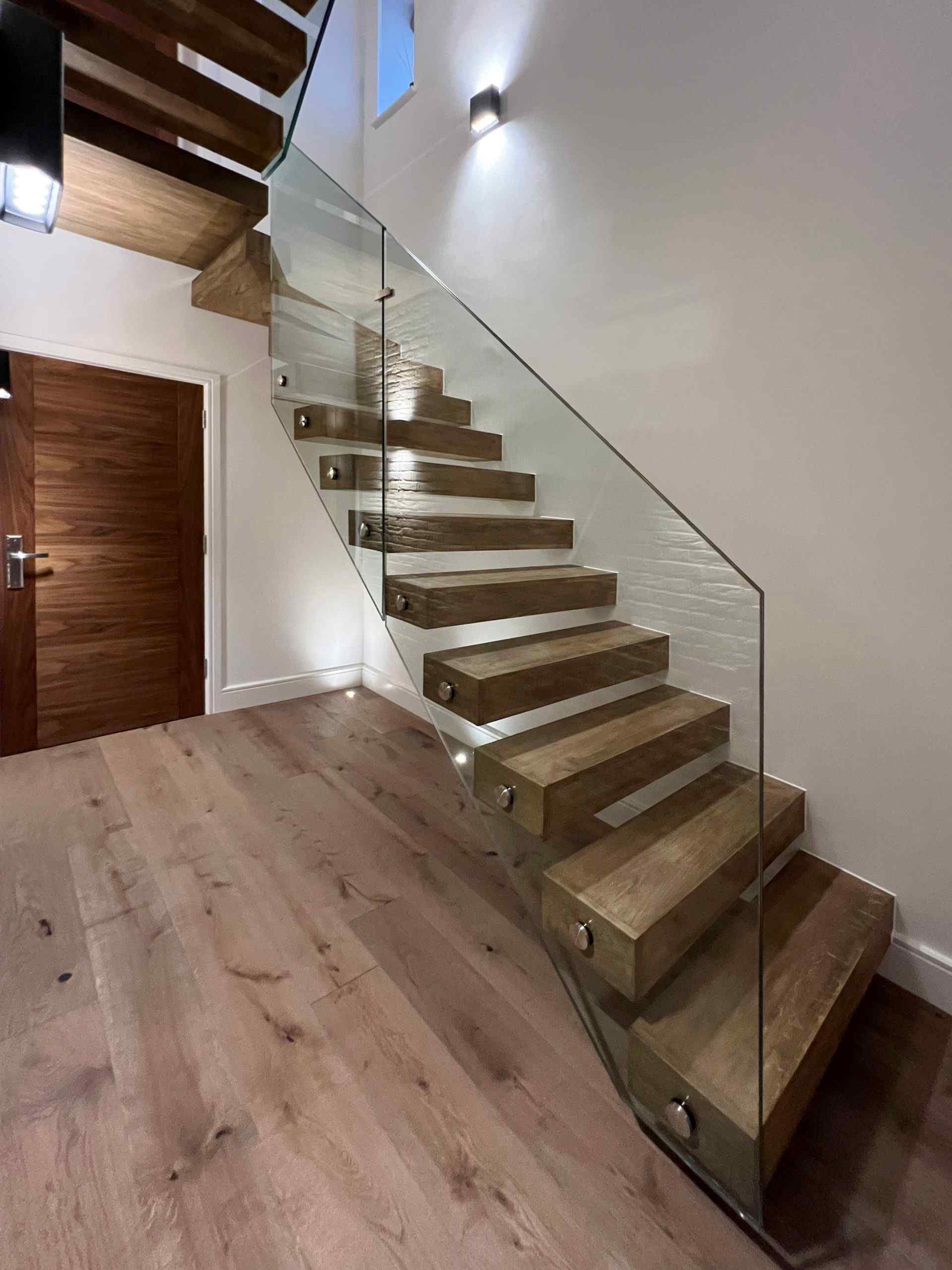 floating staircase with glass balustrade