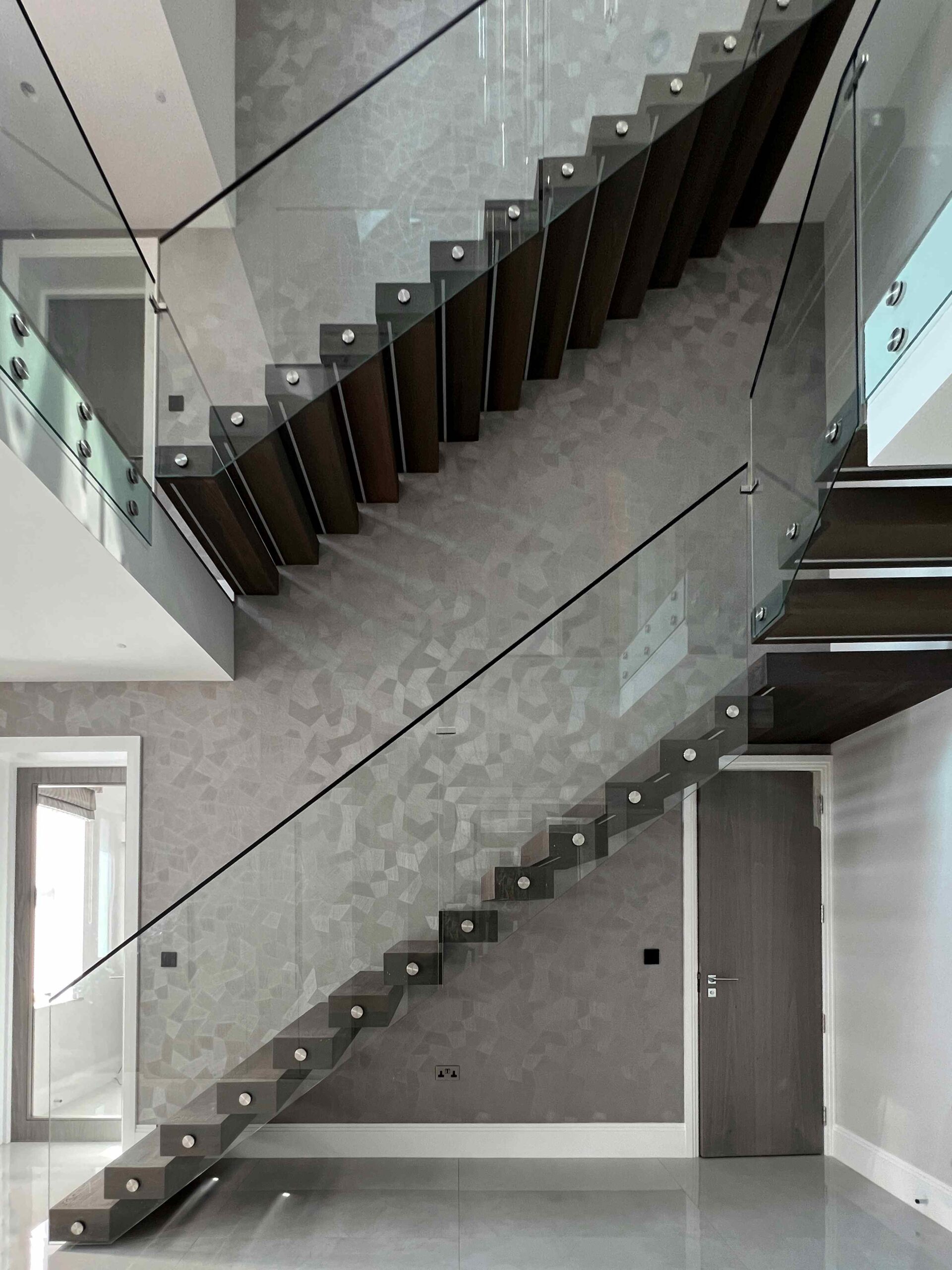 Floating staircase with glass balustrade