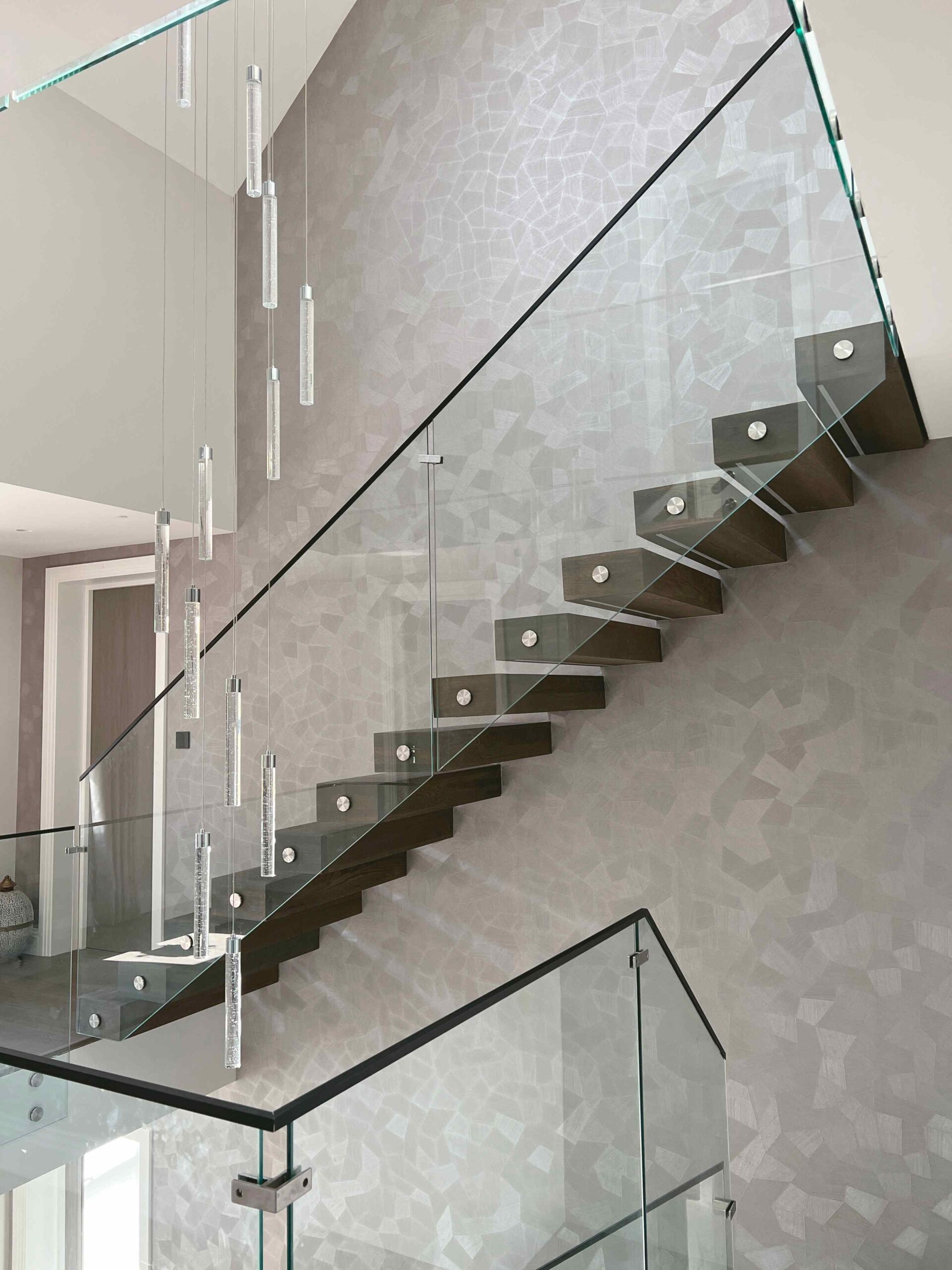 side view of a Floating staircase with glass balustrade