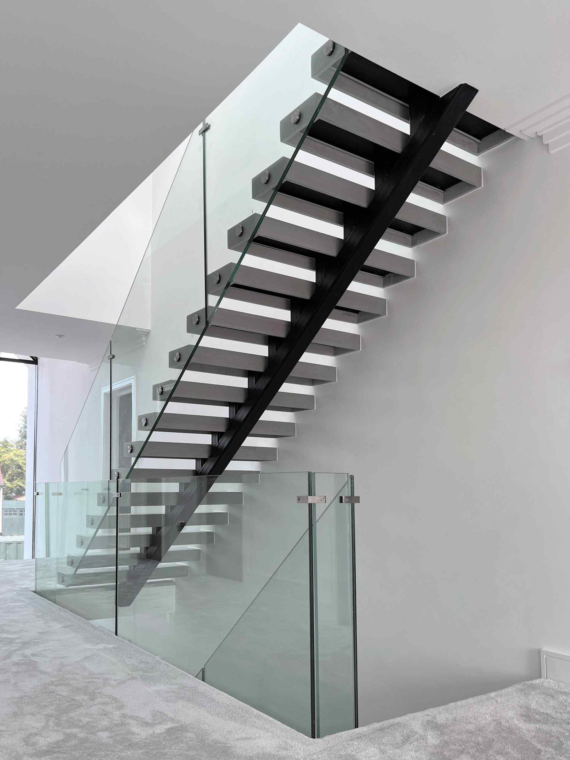 Bottom view of spine staircase with glass balustrade