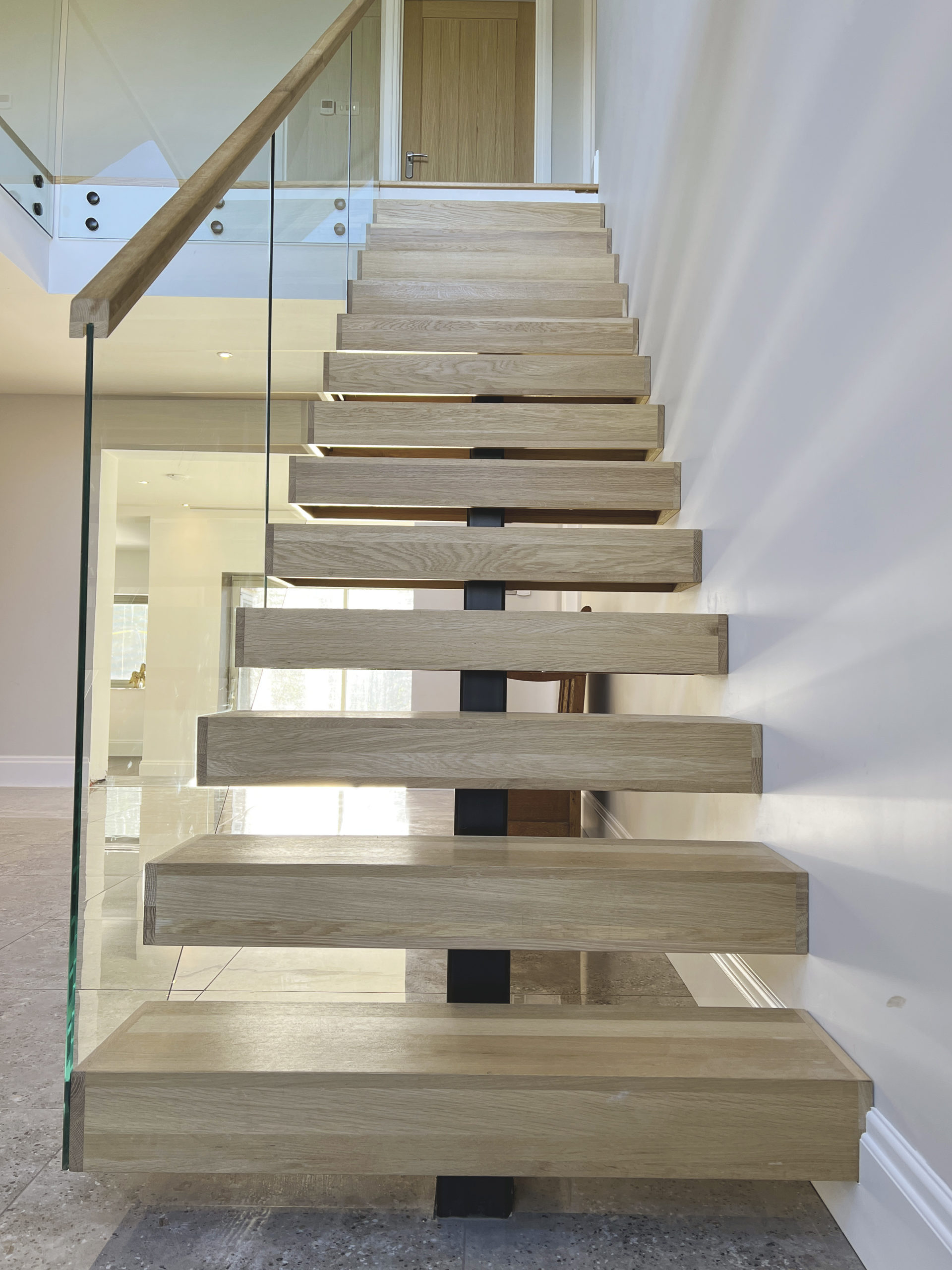 spine staircase with bolted glass balustrades
