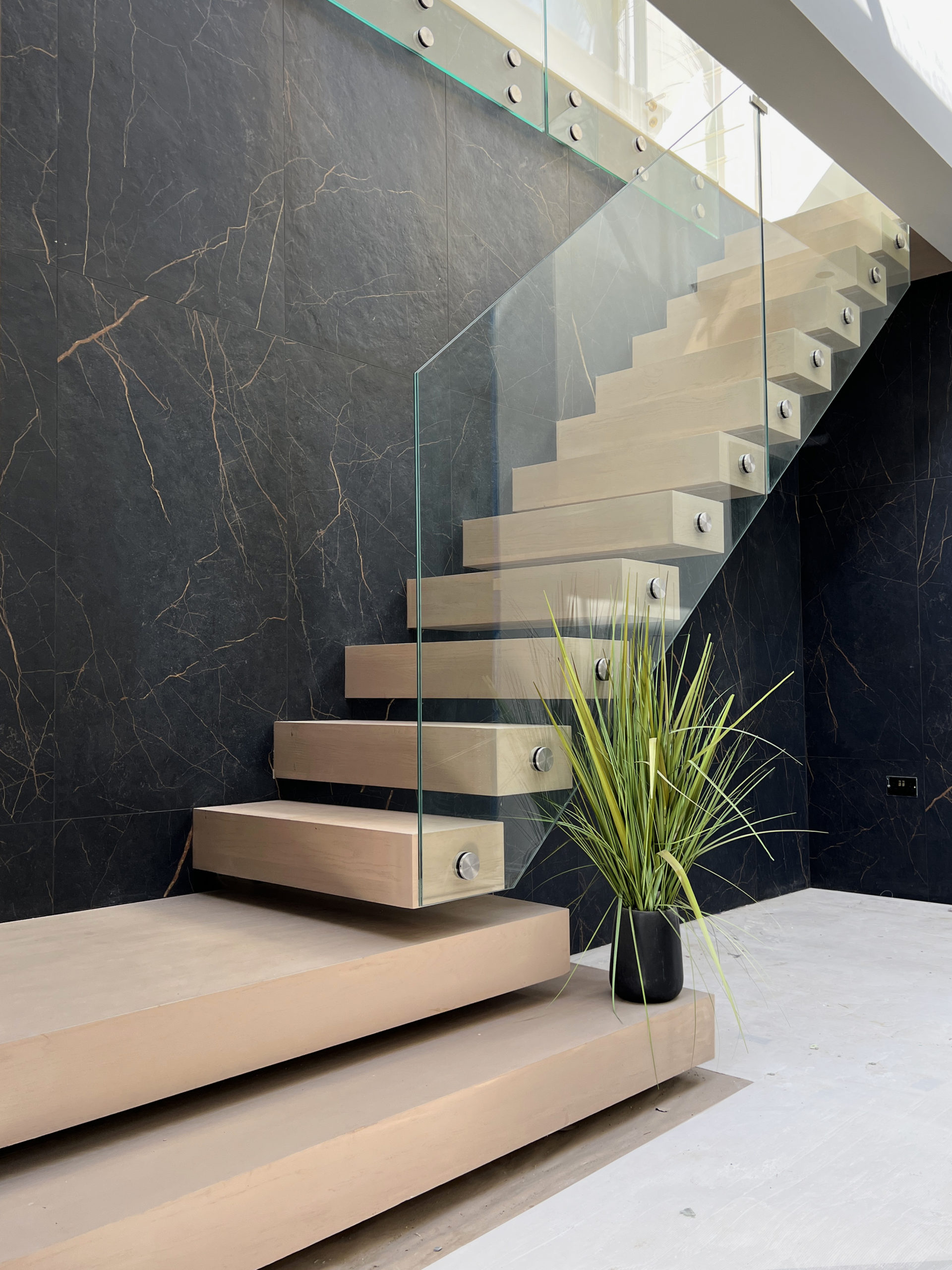 Floating staircase with glass balustrade, oak stair treads
