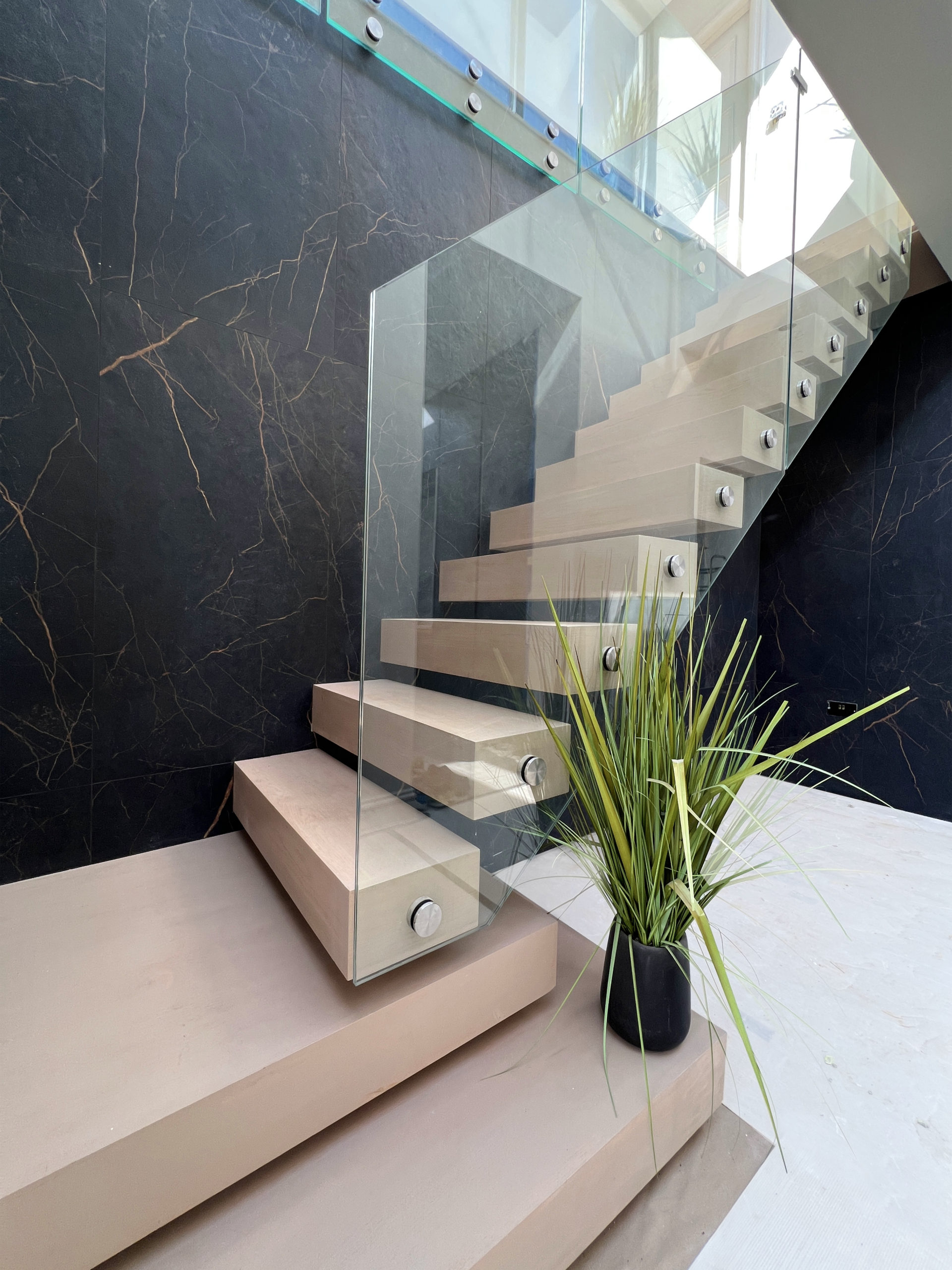 Floating staircase with glass balustrade, oak stair treads